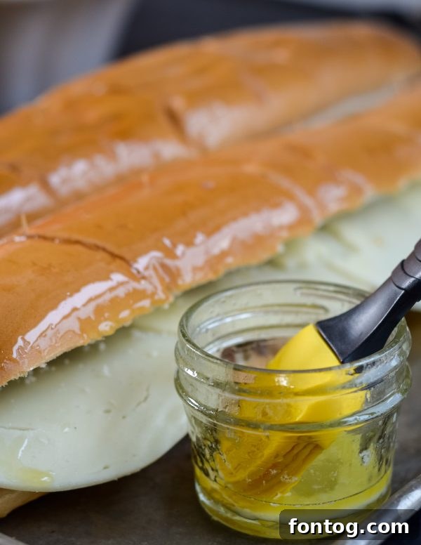Toasted French Dip Sandwich with melted cheese and dipping au jus