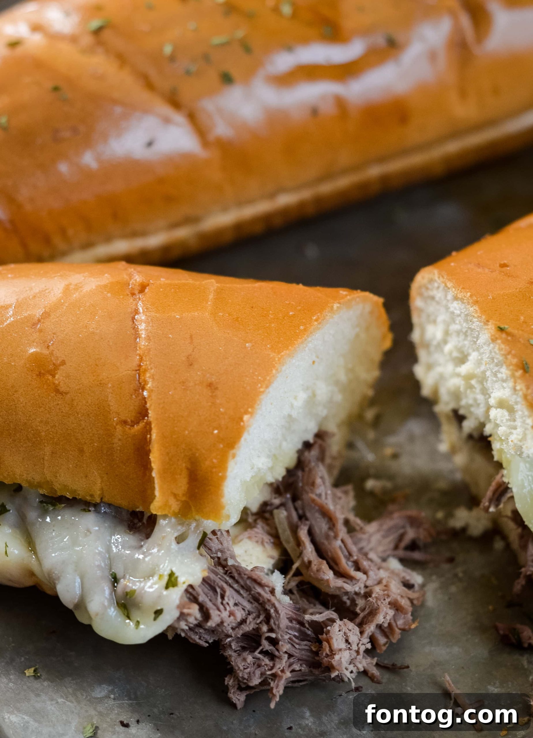 Best Juicy Slow Cooker French Dip Sandwiches - perfect for a busy weeknight!