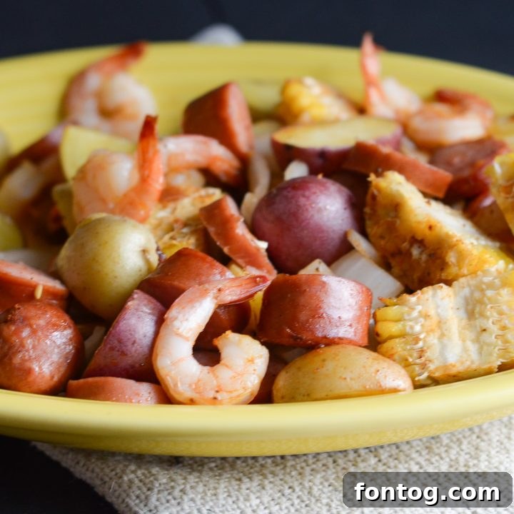 A vibrant Cajun Shrimp Boil in the Air Fryer, featuring succulent shrimp, corn, and potatoes, packed with spicy flavor.