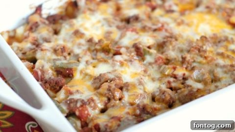 Hearty and cheesy potato taco casserole, baked to a golden brown perfection.