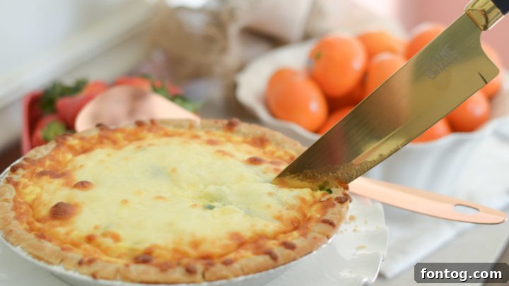Slice of Ham and Cheese Quiche on a plate