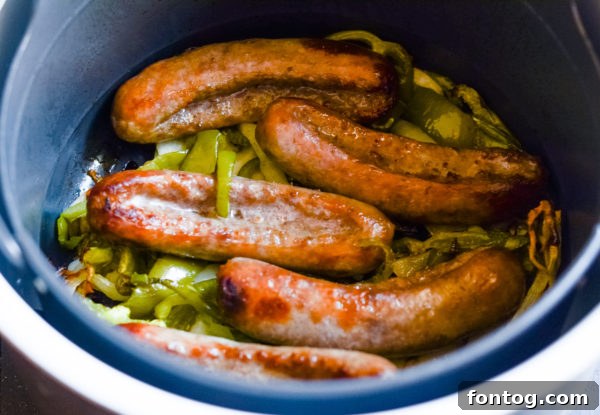 Several raw Johnsonville Beer Brats ready to be cooked in an air fryer
