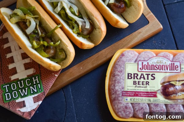 Air Fryer Beer Brats cooking in the air fryer basket with onions and peppers