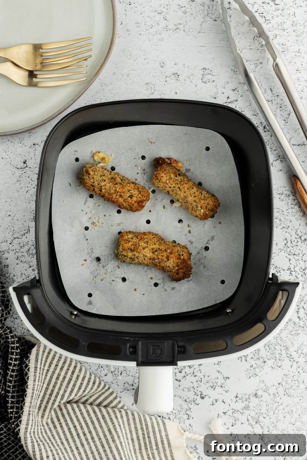 Golden & Gooey: Ninja Foodi Gluten-Free Mozzarella Sticks 4 Gluten-free breadcrumbs in a bowl, ready for coating.