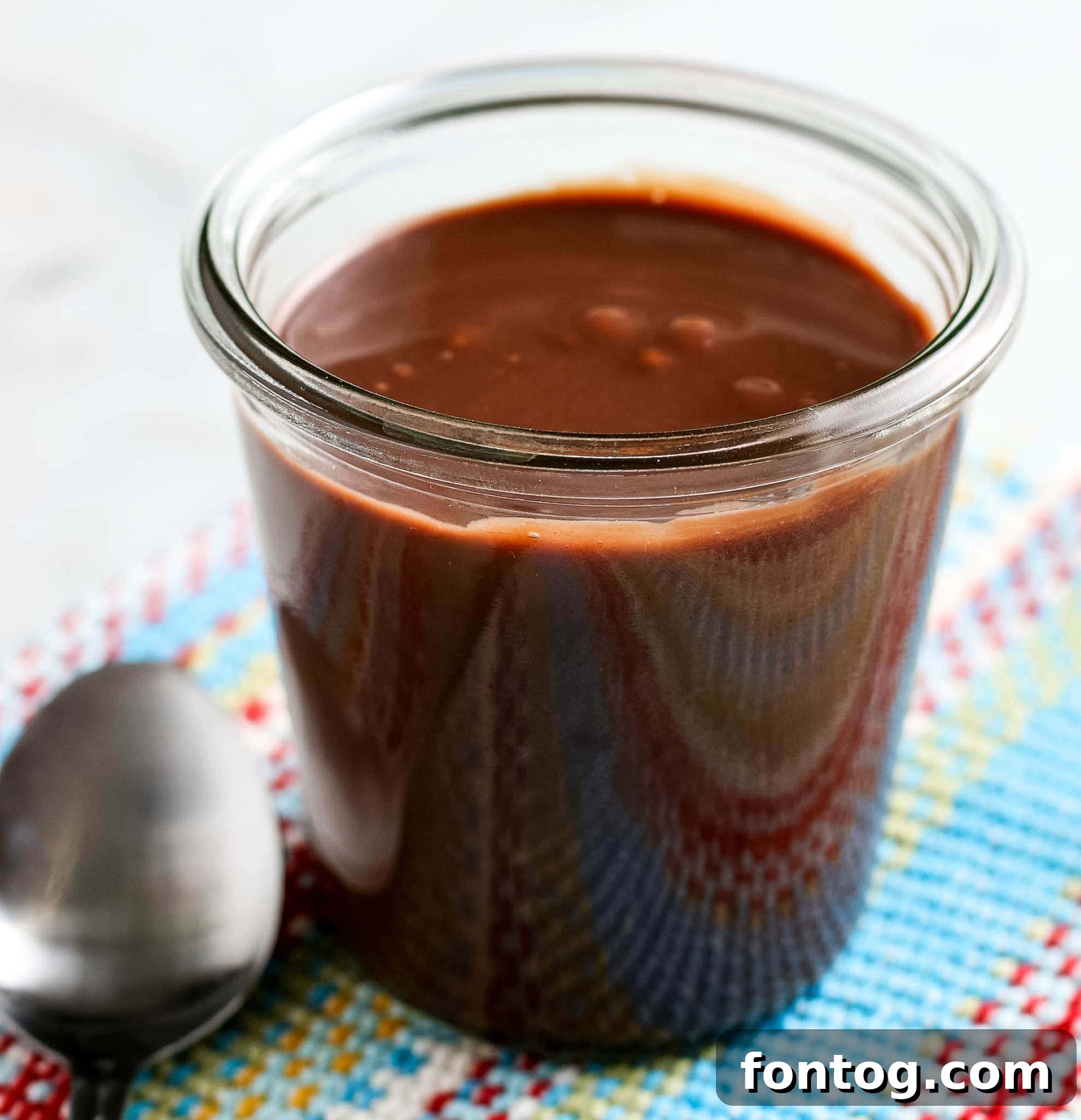 A rich, glossy classic hot fudge sauce, perfect for topping any dessert.