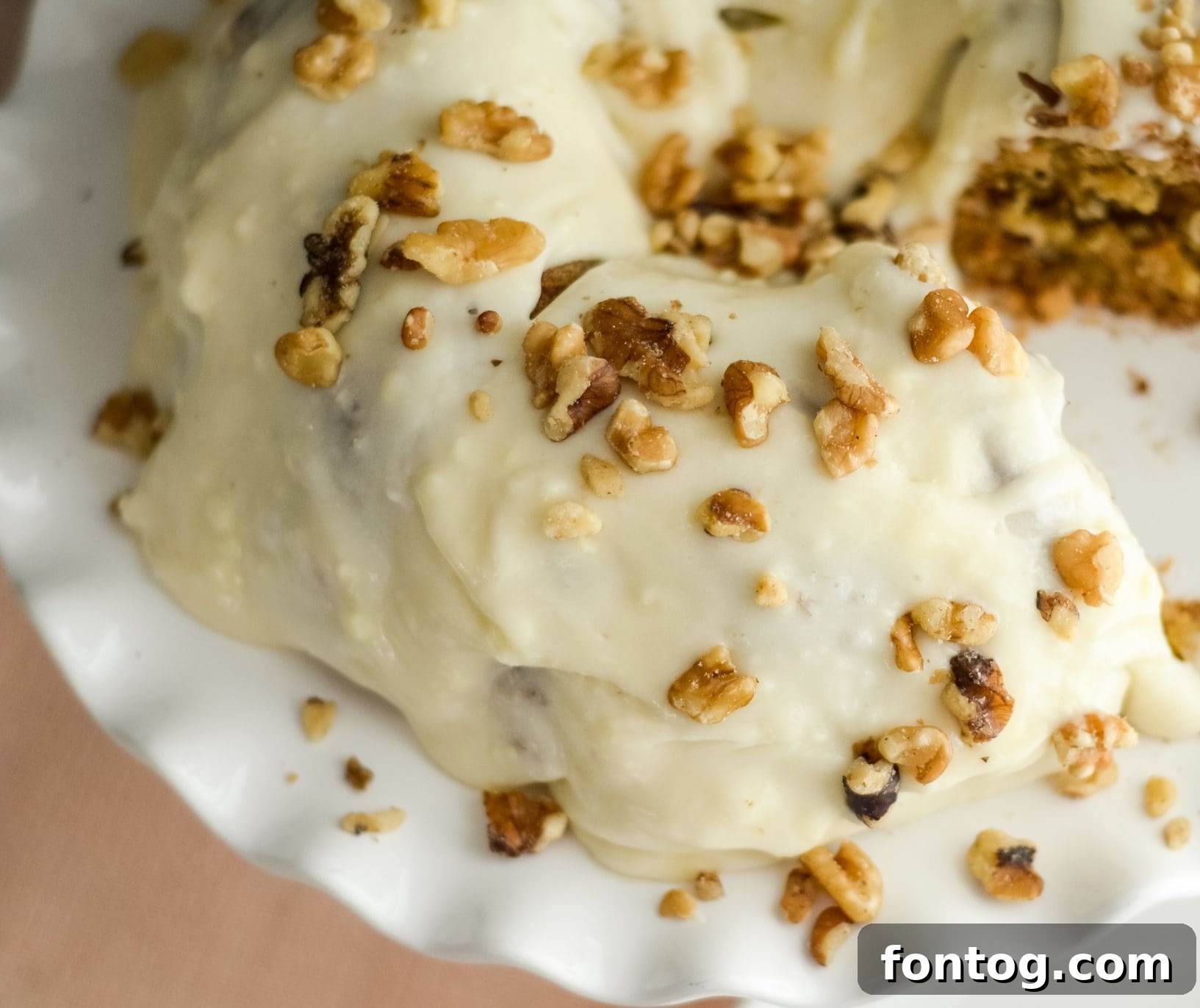 A moist and flavorful Ninja Foodi carrot cake, topped with cream cheese frosting.