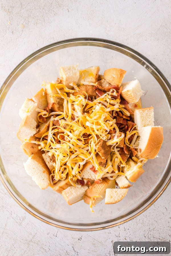 Ninja Foodi Signature Bacon Cheese French Toast 3 Cubed stale French bread, ready for the Ninja Foodi French Toast casserole mixture.