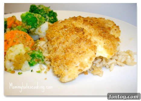 Parmesan Breaded Fish Crispy Parmesan Breaded Fish with lemon wedges