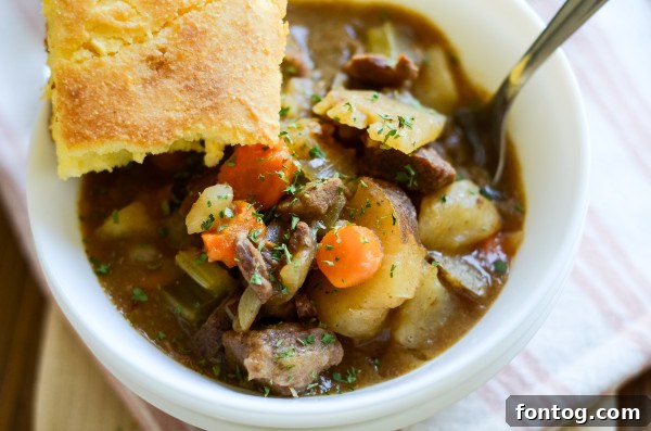 Slow cooker filled with gluten-free beef stew ingredients